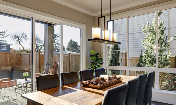 dining room surounded by tall windows