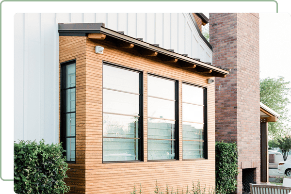 exterior of an addition on a house covered in windows
