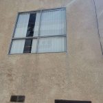 barred-window-stucco-building-calabasas